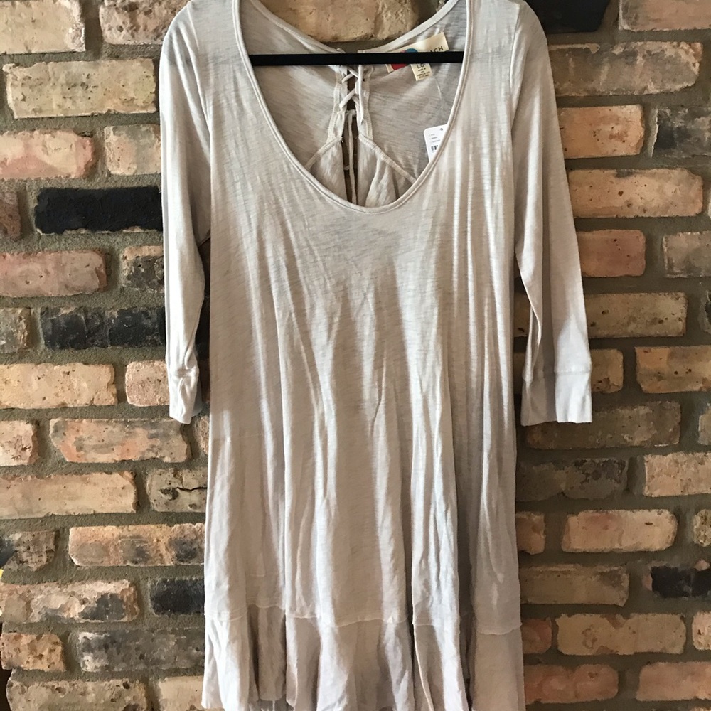 L Free people white long sleeve with back cut out.